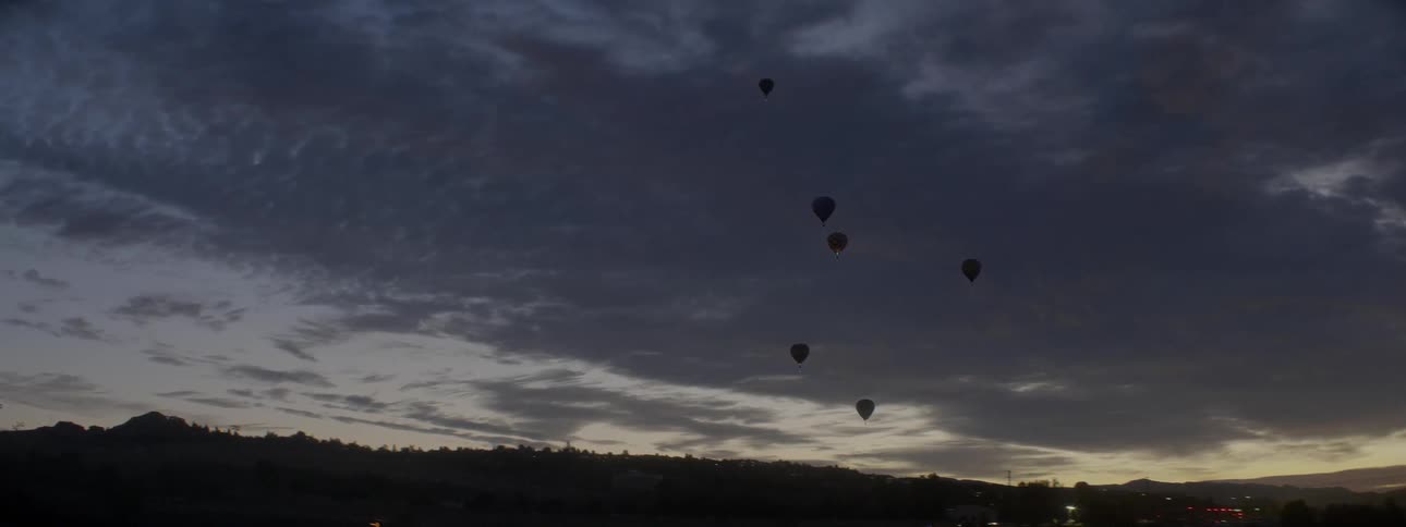 Hot air balloons float in the sky