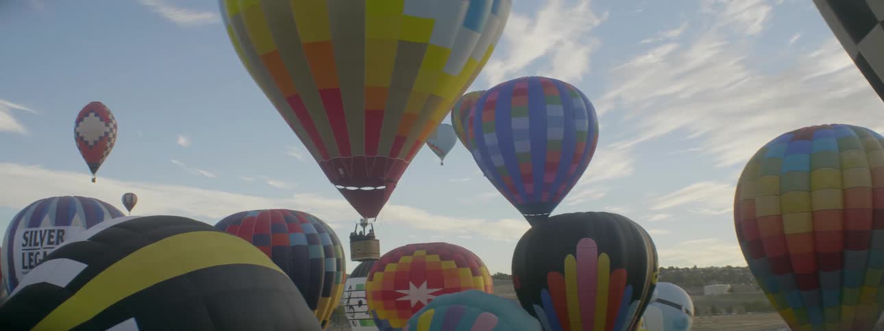 Hot air balloons lift off into the sky
