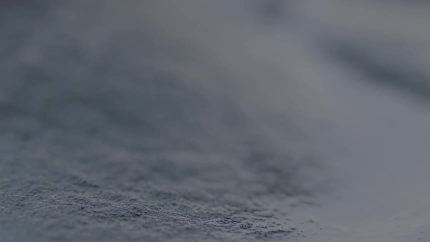 Liquid sand is moving and swaying as its being vibrated