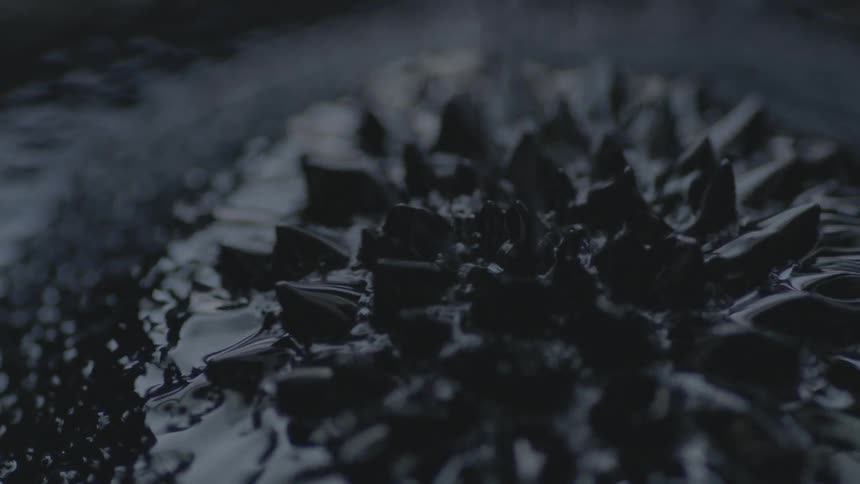 Dark liquid flows and forms spikes