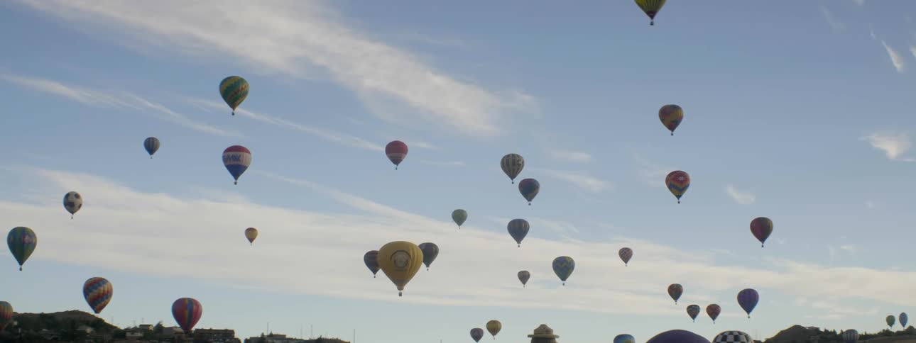 Hot air balloons float in the sky