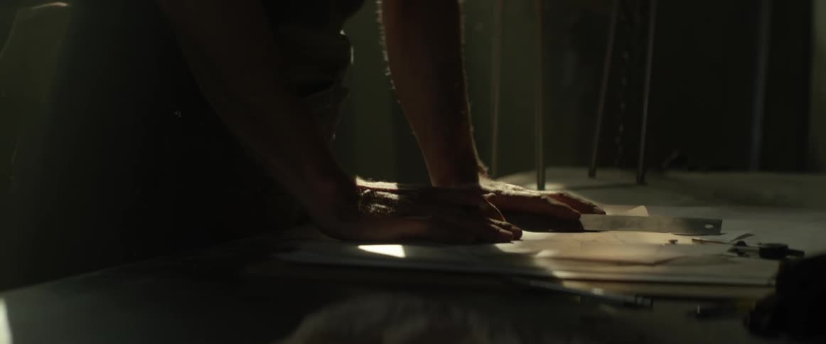 A man sketches in his workshop