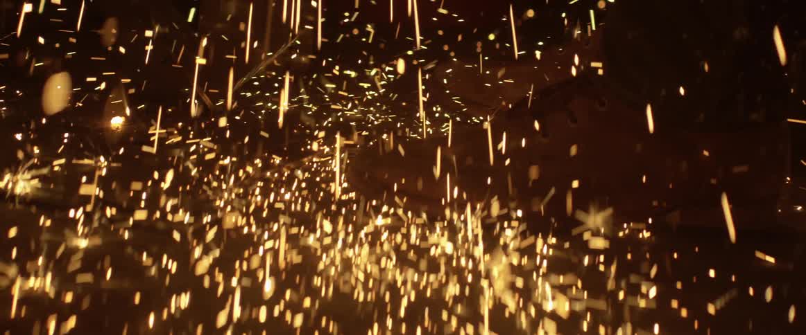 Sparks are falling onto a floor