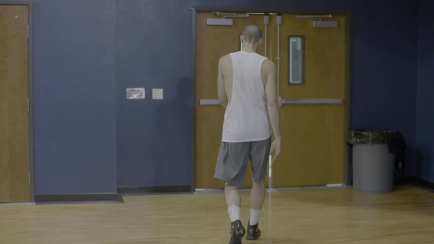 A person walking in a gym