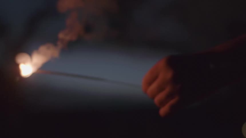 A person holding a sparkler