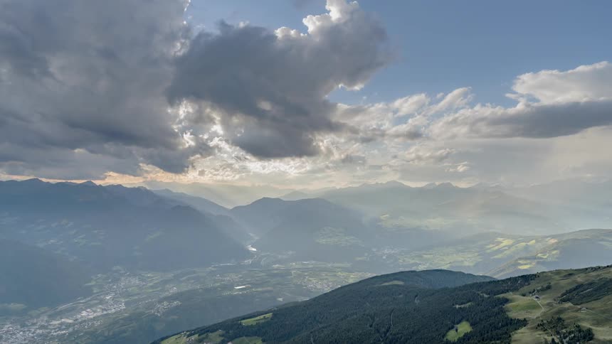 Clouds roll over a valley