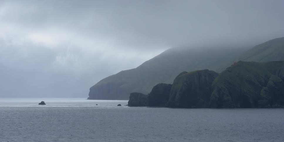 Water flows towards the rocky shore