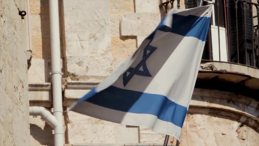 An israel flag waves in the breeze