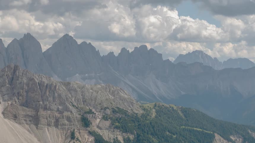 Clouds pass above the mountains