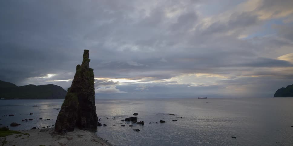 Rock formation juts out of ocean