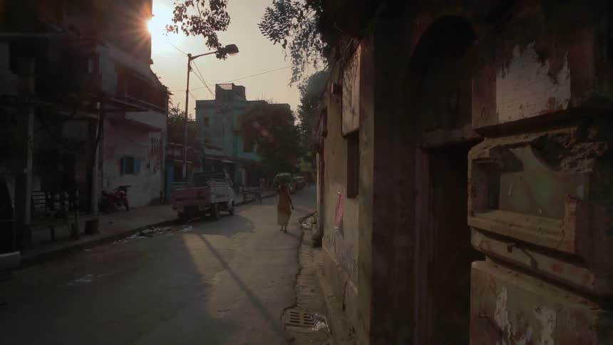 People walking down a rural town street