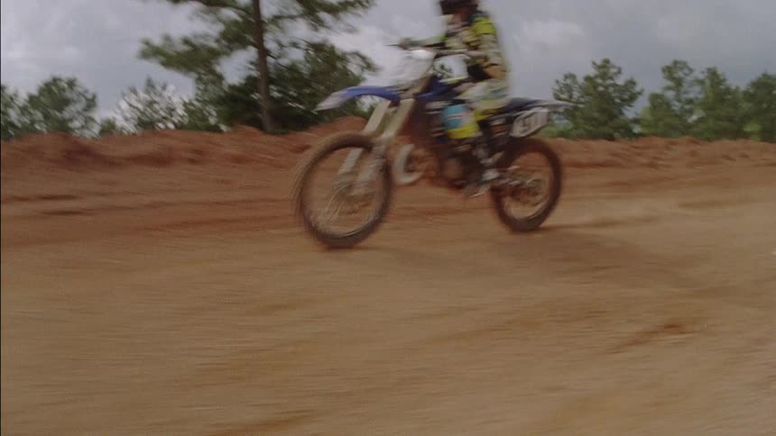 The dirt bikes are racing on the track