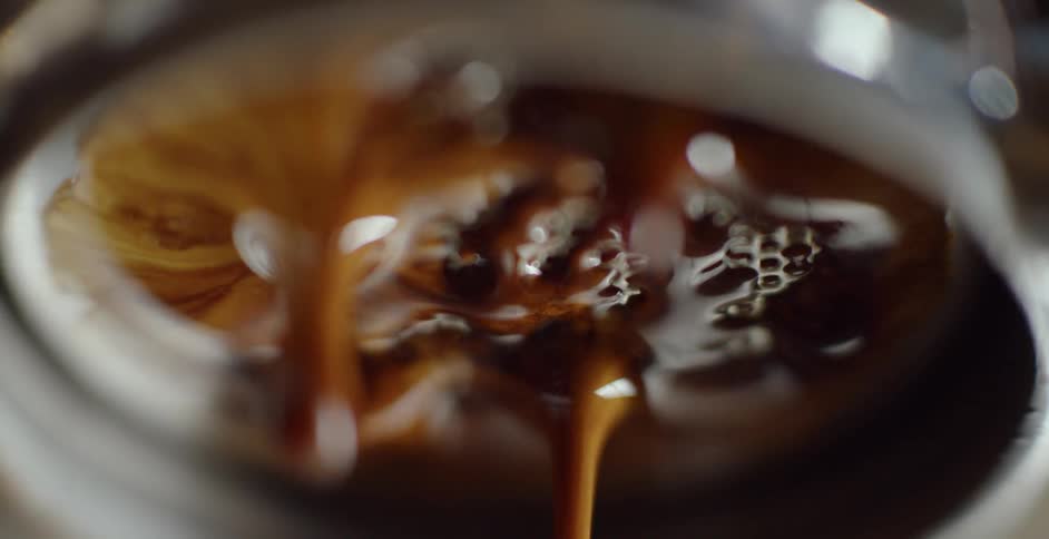 Honey pours from a honeycomb