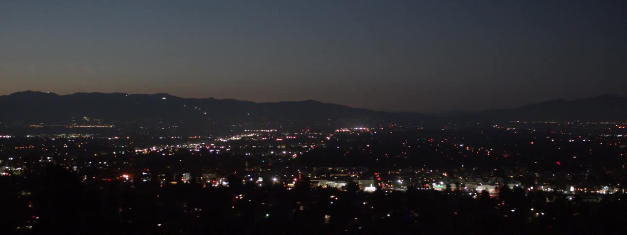City lights glow at dusk