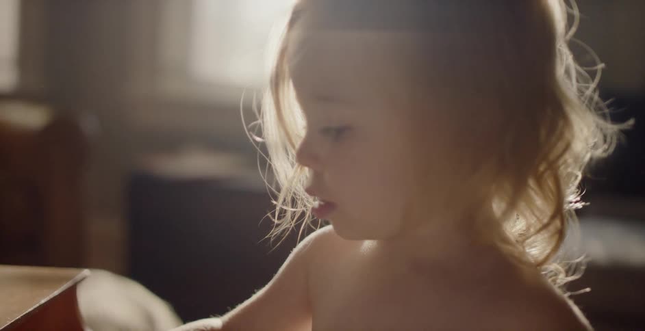 A small child is playing the piano
