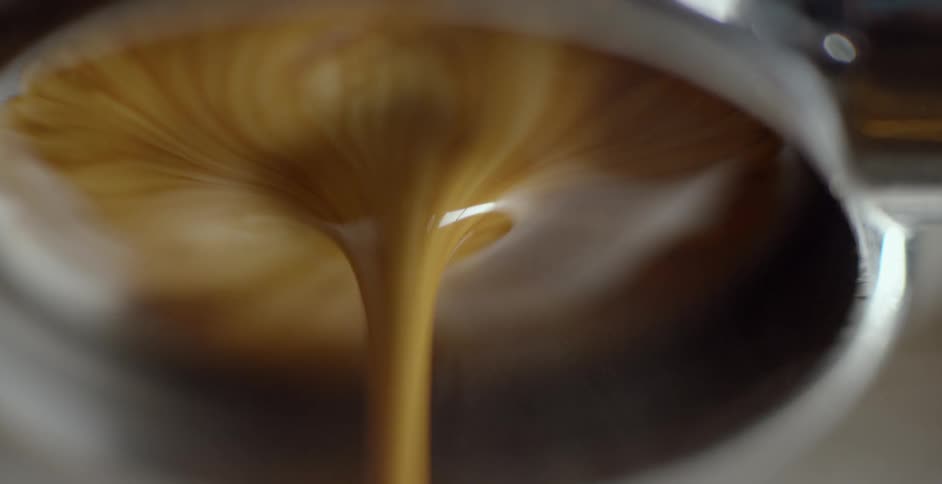Brown coffee is poured in a spiral