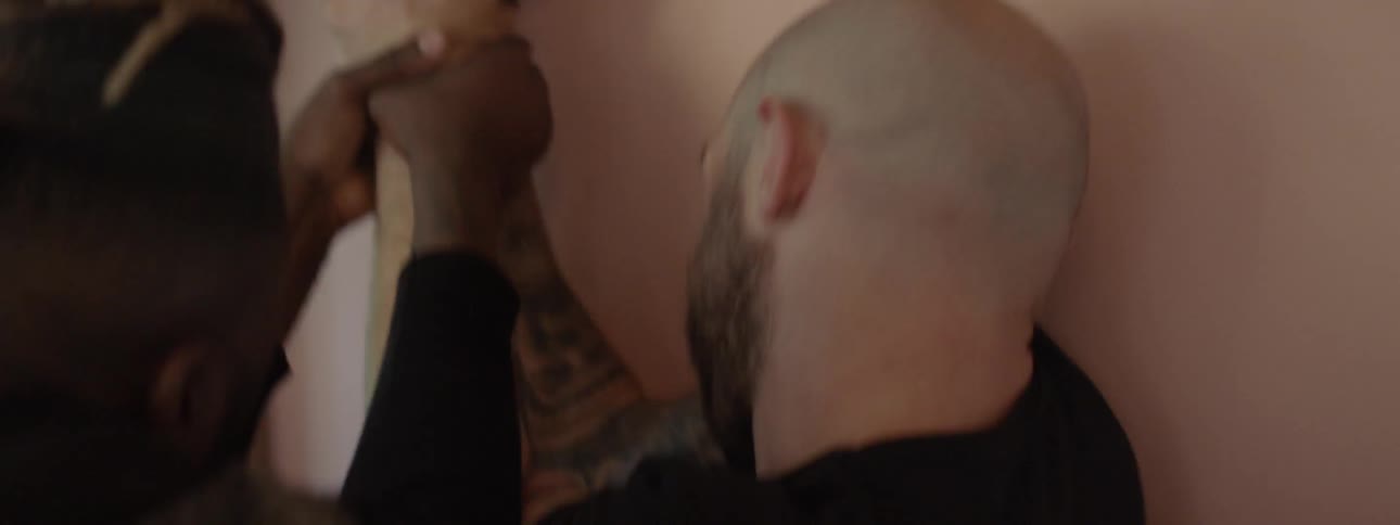 Two men fight over a handgun
