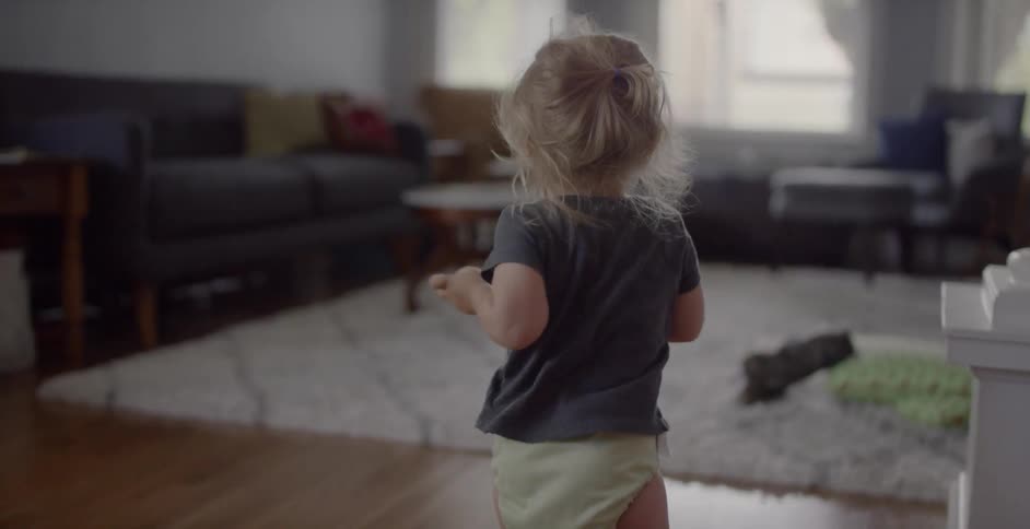 A child runs into the living room
