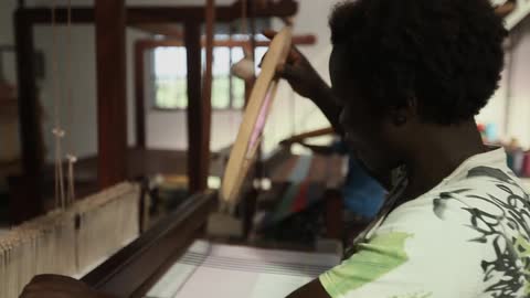 Man working on a loom