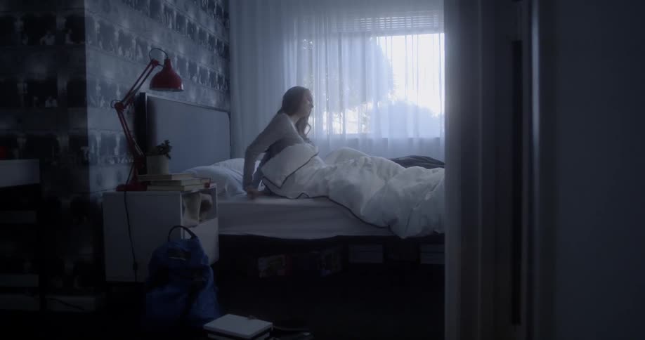 A woman is sleeping in the bedroom