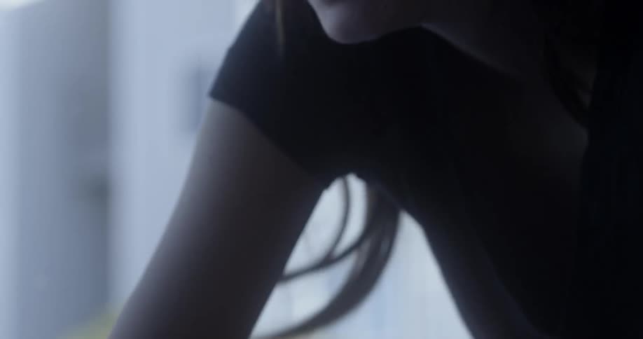 A woman is exercising at home