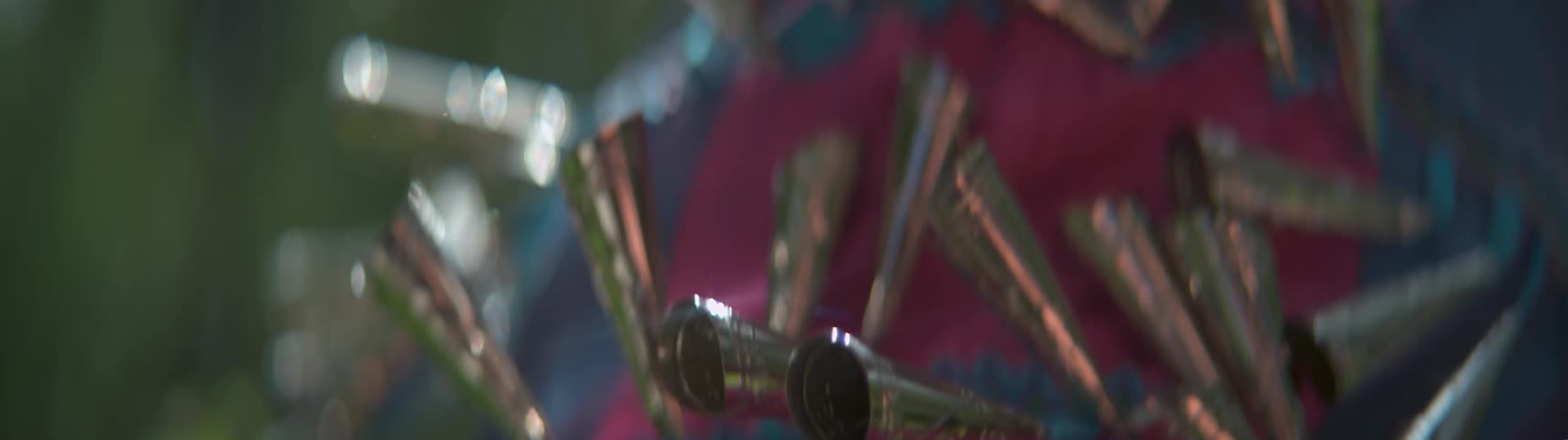 The bells sewn onto a skirt fly up as the person moves
