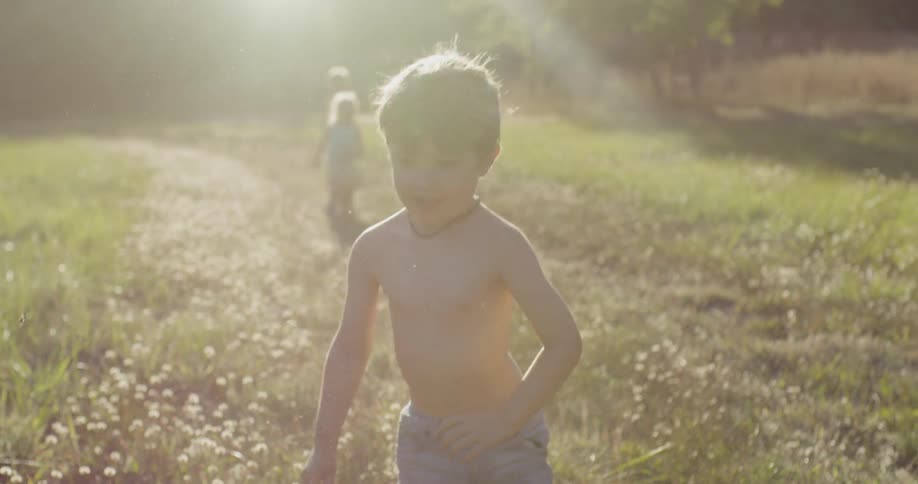 A group of kids are playing in a grassy field
