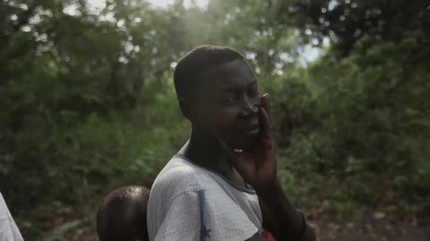 A person carrying a baby