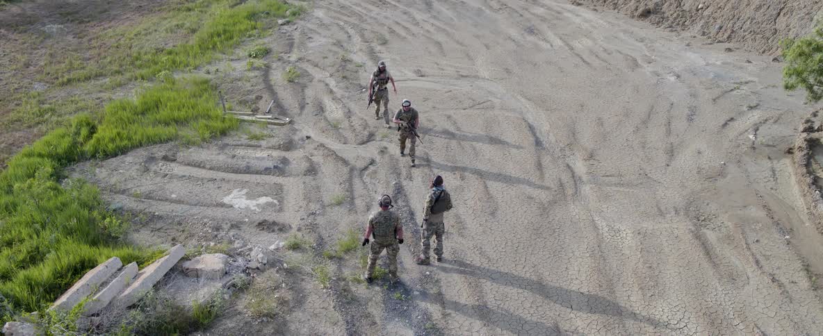 Soldiers meet on a dusty road