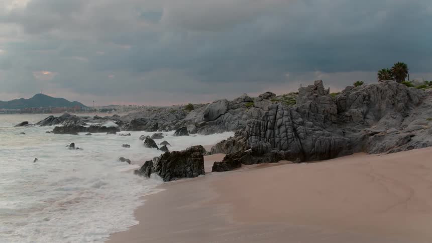 The waves are rough and crashing on the shore