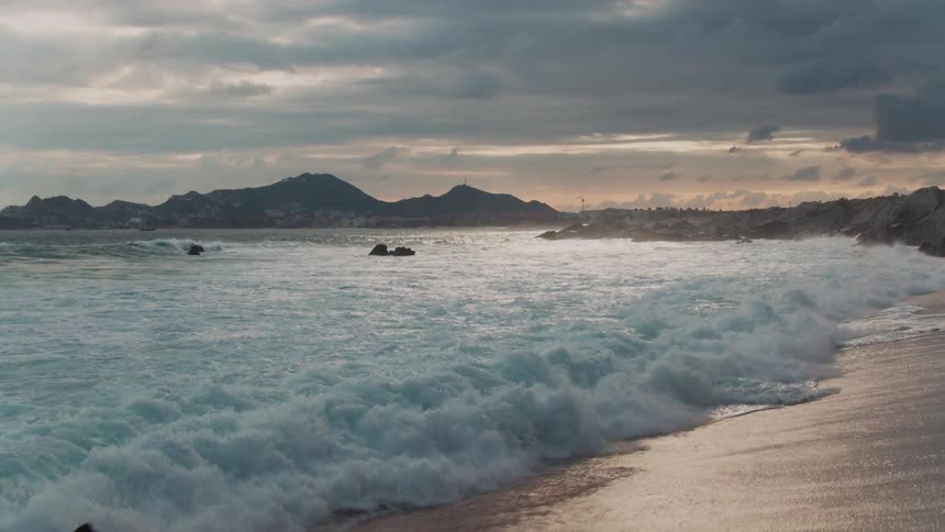 Waves crash onto the shore