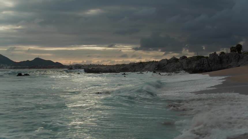 Waves crash onto the shore