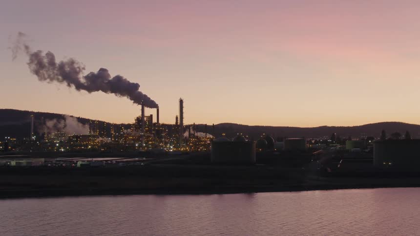Sunset oil refinery harbor water traverse (left to right)