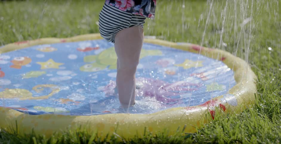 A child splashes around in the water