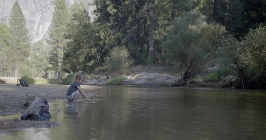 A young girl splashes in the water