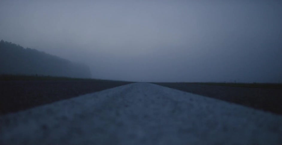 The road has a large white line painted in the middle
