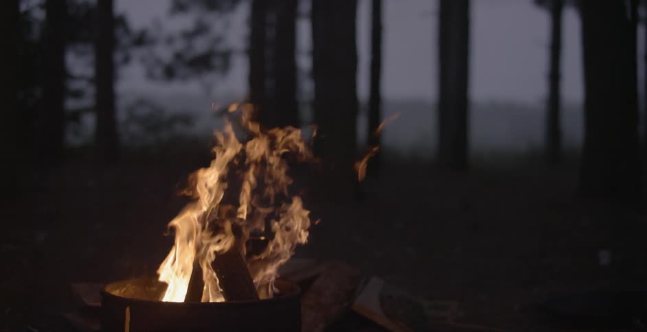 The fire in the barrel burns at dawn