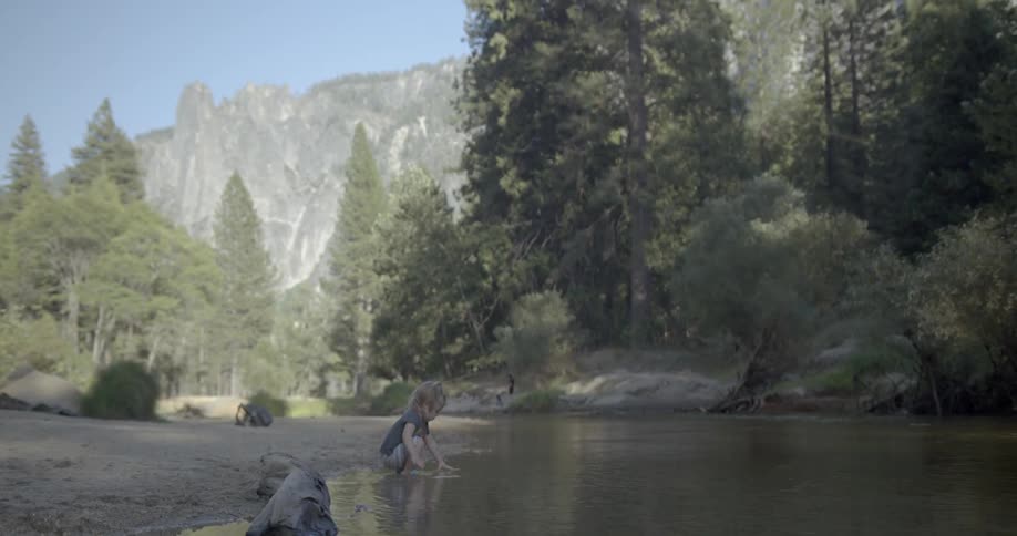 A young girl splashes in the water