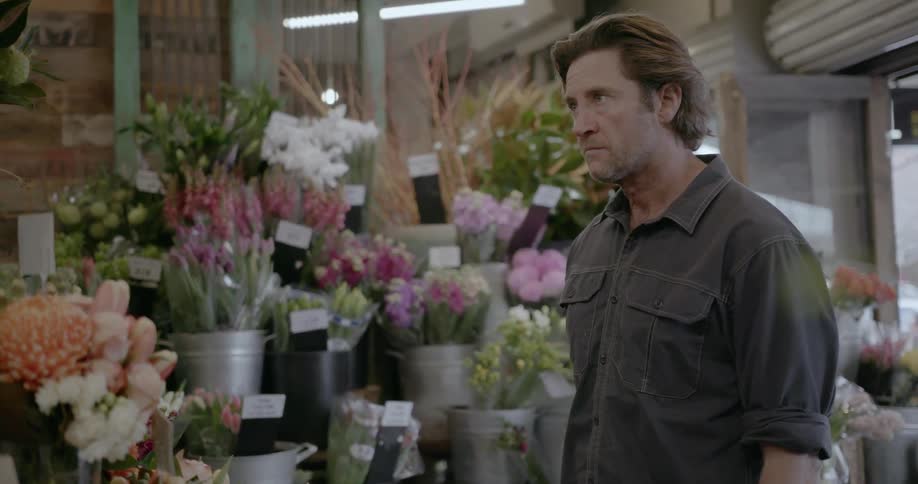 A man walks into a flower shop