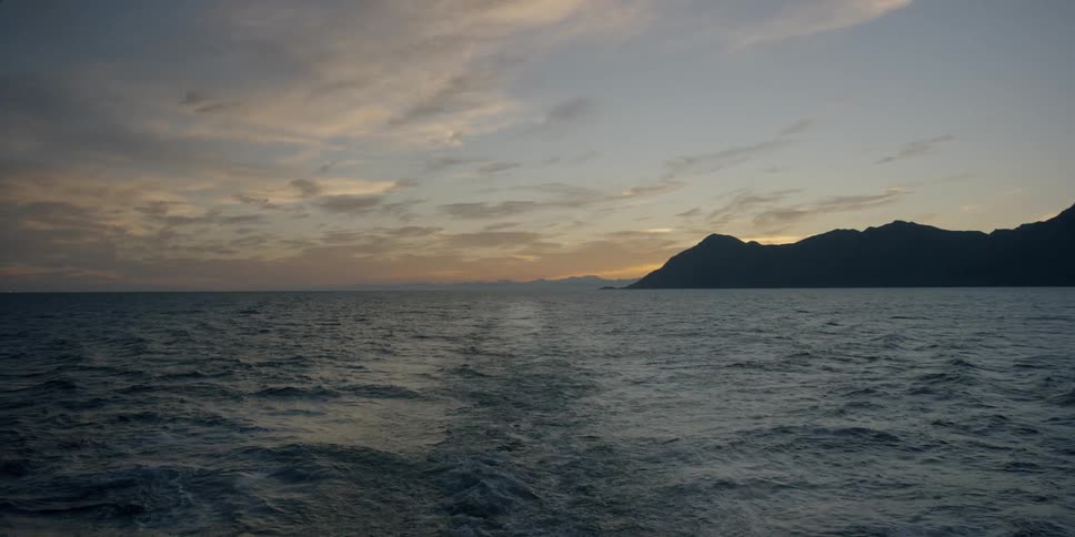 The ocean at sunset from a boat