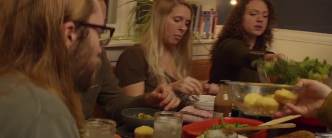 A group of friends eating dinner together