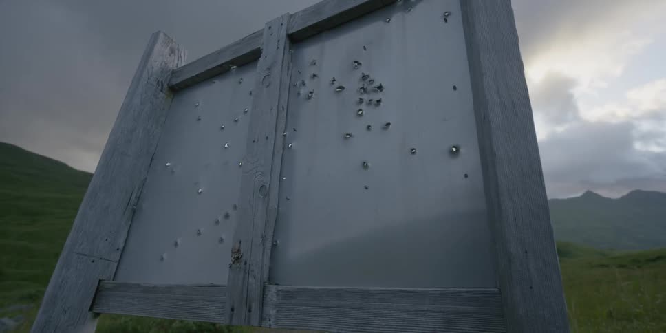 A holey sign near the road