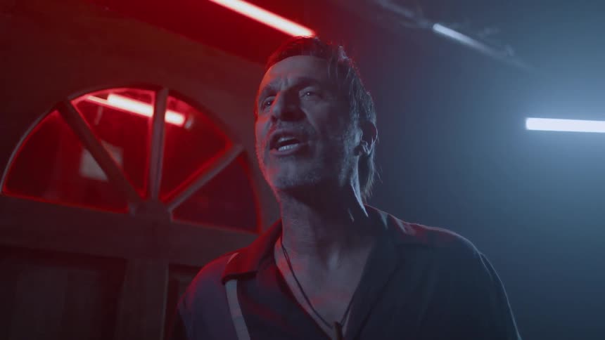 A man yells at another near a door