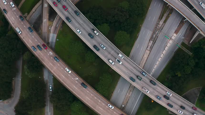 Vehicles travel on overpass highway bridges