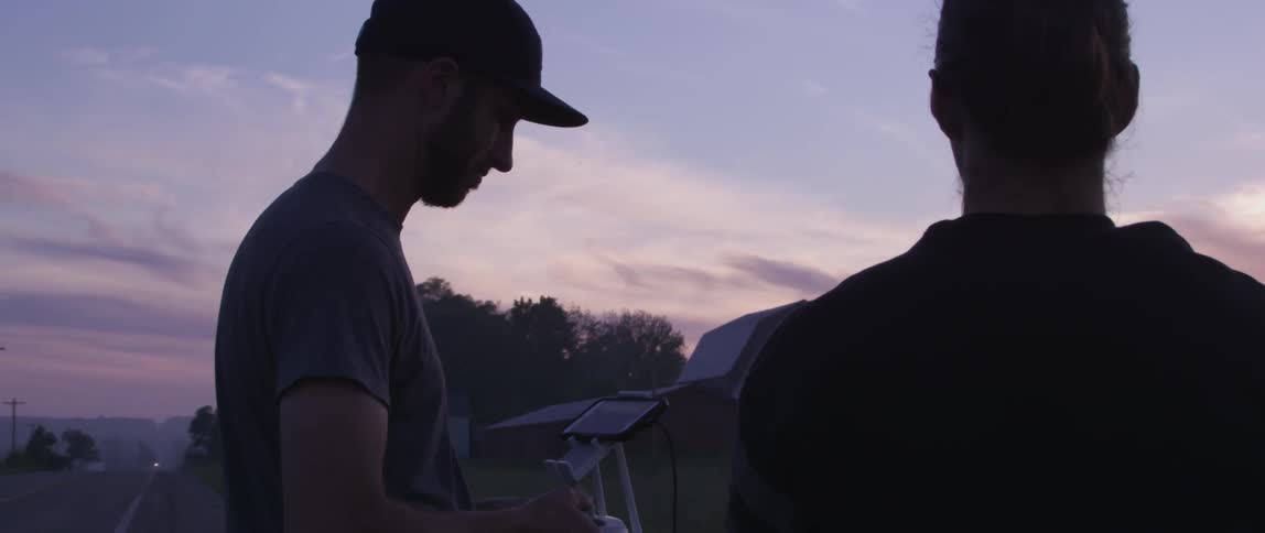 A person looking down at a phone