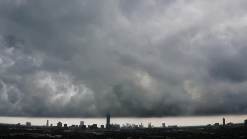 Storm clouds brew and move towards the city
