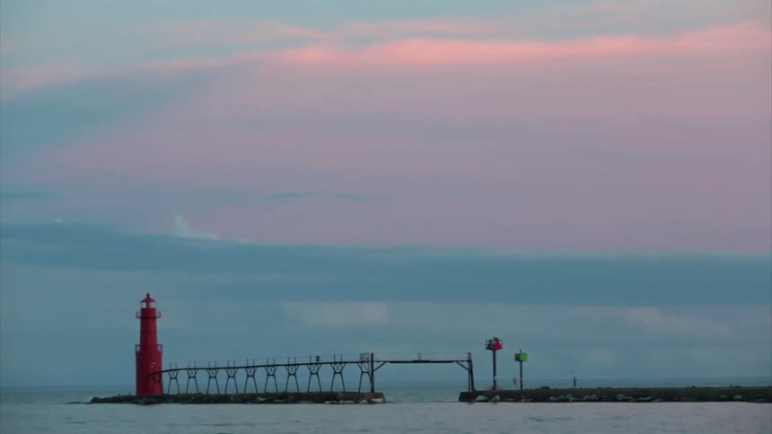 A timelapse of a lighthouse at dawn