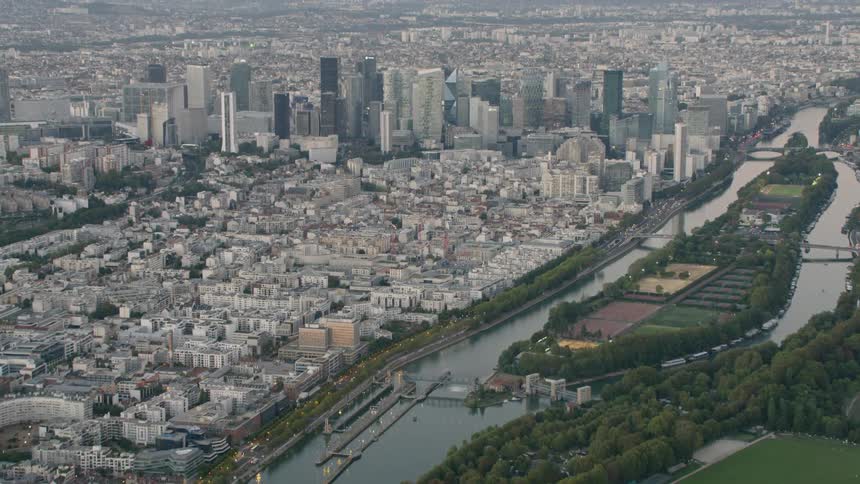 A canal stretches through the middle of a large city