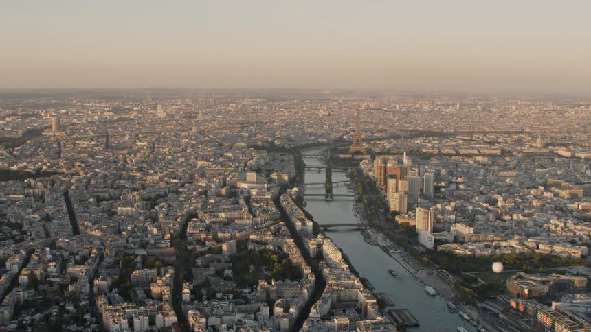 A canal stretches through the middle of a large city