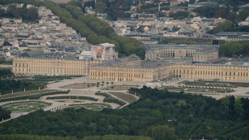 A large government building is filmed from a passing drone